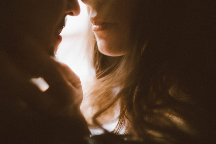 Intimate couple close-up showing erotic spark and connection in relationship